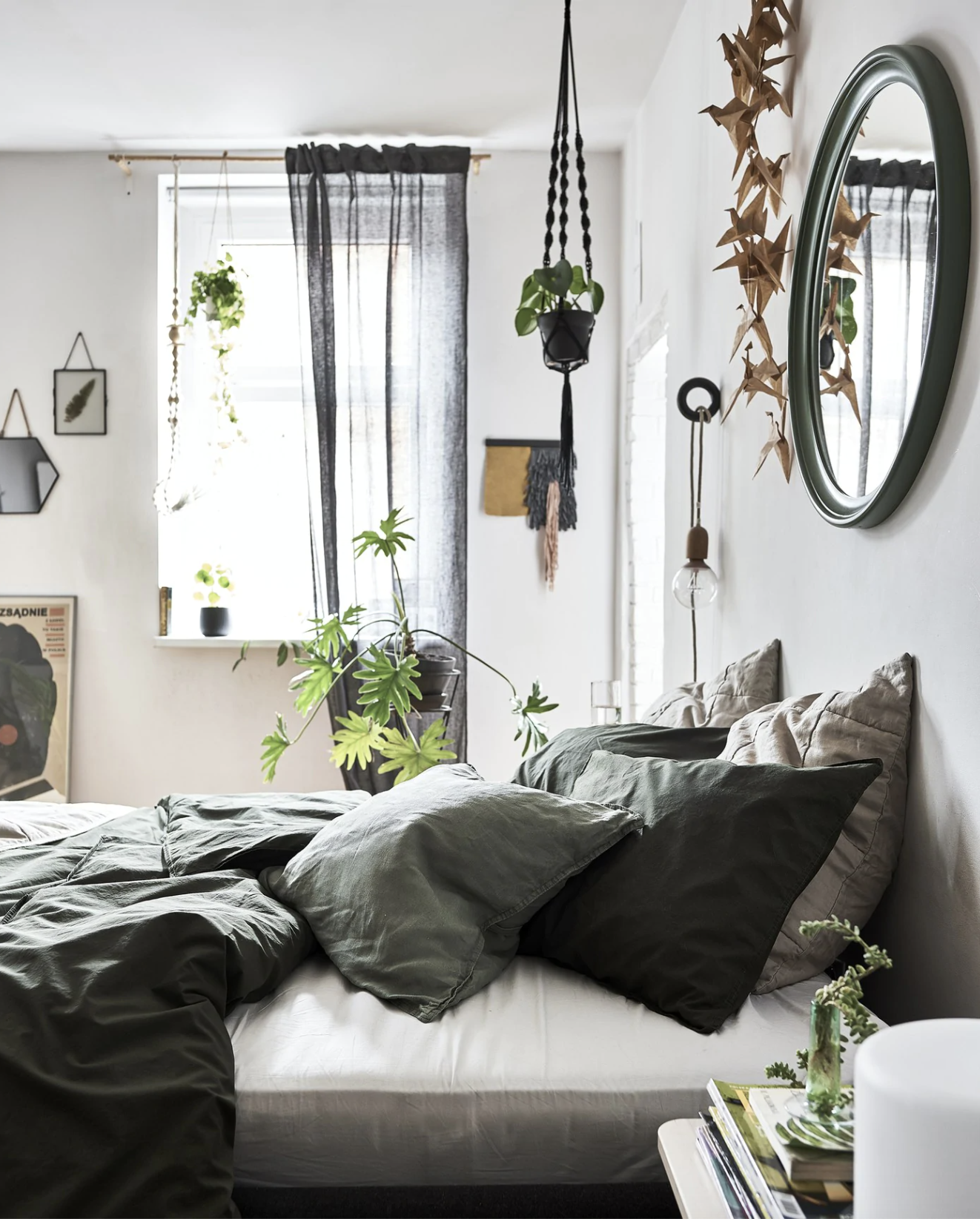 a dark gray and black Bedroom idea, with houseplants aplenty