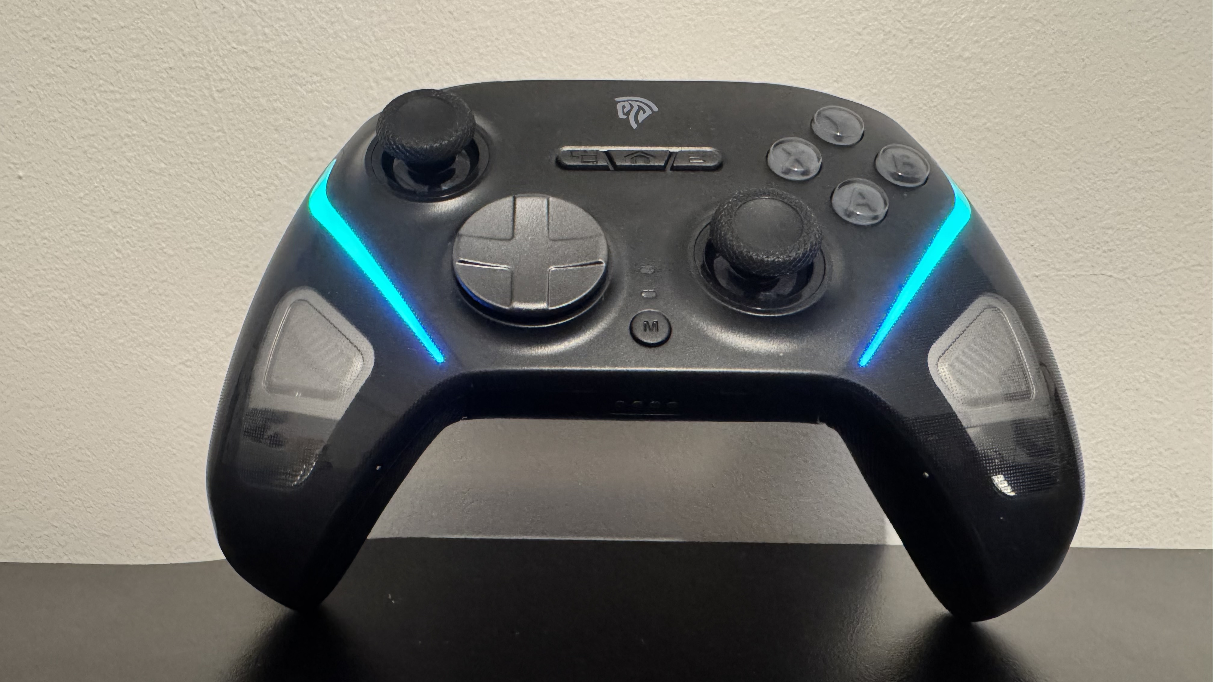 turned on EasySMX D10 by itself on a black desk