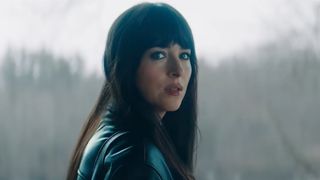 Dakota Johnson looking over her shoulder in Verity. 