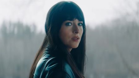 Dakota Johnson looking over her shoulder in Verity. 