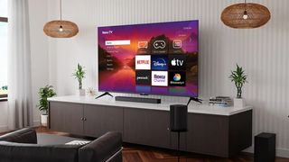 Roku Plus Series 4K QLED TV on tv stand