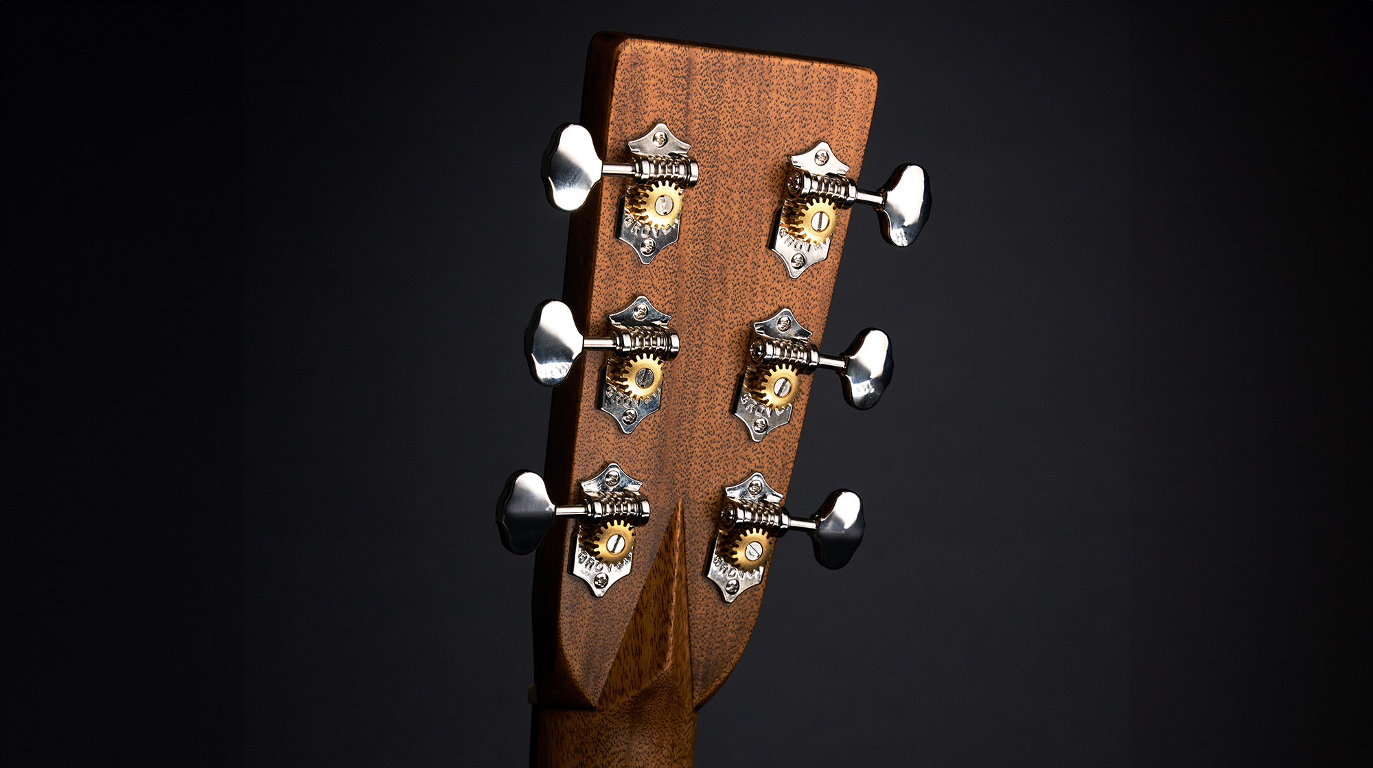 A photo showing the back of the headstock of a Martin O&#039;ahu HG-28 acoustic guitar