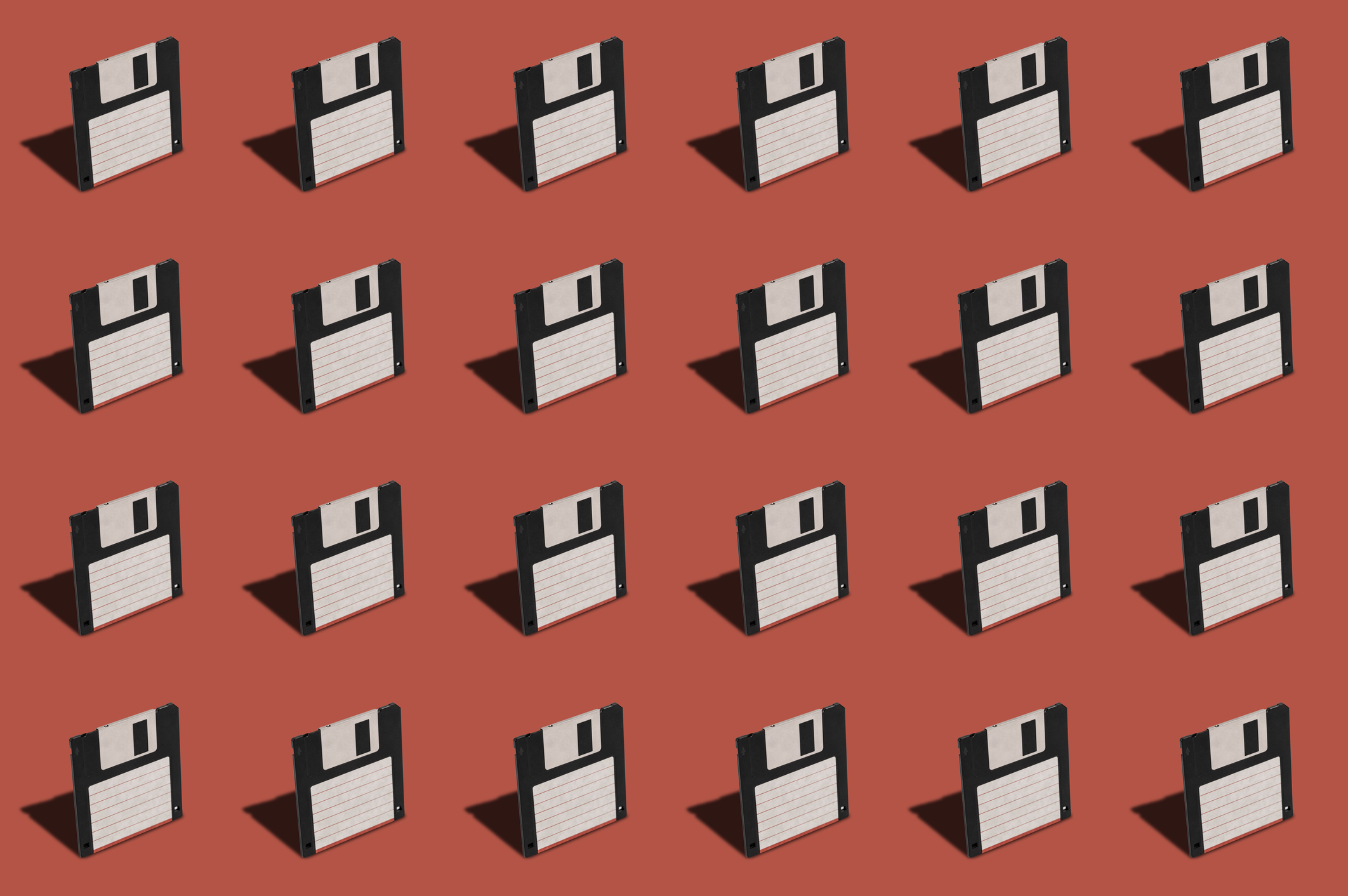 floppy discs on a red background