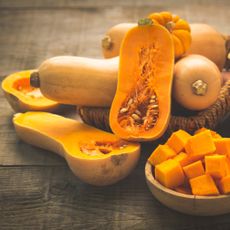 Whole, halved, and cubed butternut squashes