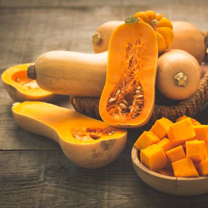 Whole, halved, and cubed butternut squashes