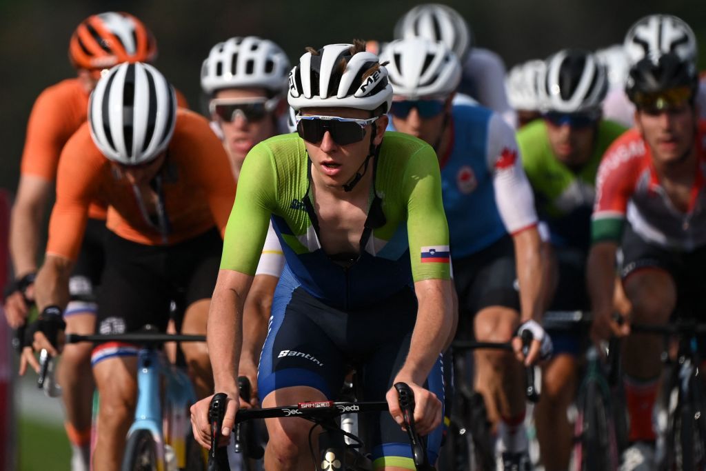 Slovenias Tadej Pogacar C rides on the peloton during the first lap of the Fuji International Speedway in the mens cycling road race of the Tokyo 2020 Olympic Games in Oyama Japan on July 24 2021 Photo by Greg Baker AFP Photo by GREG BAKERAFP via Getty Images