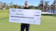 Nelly Korda with a cheque after winning the Hilton Grand Vacations Tournament of Champions