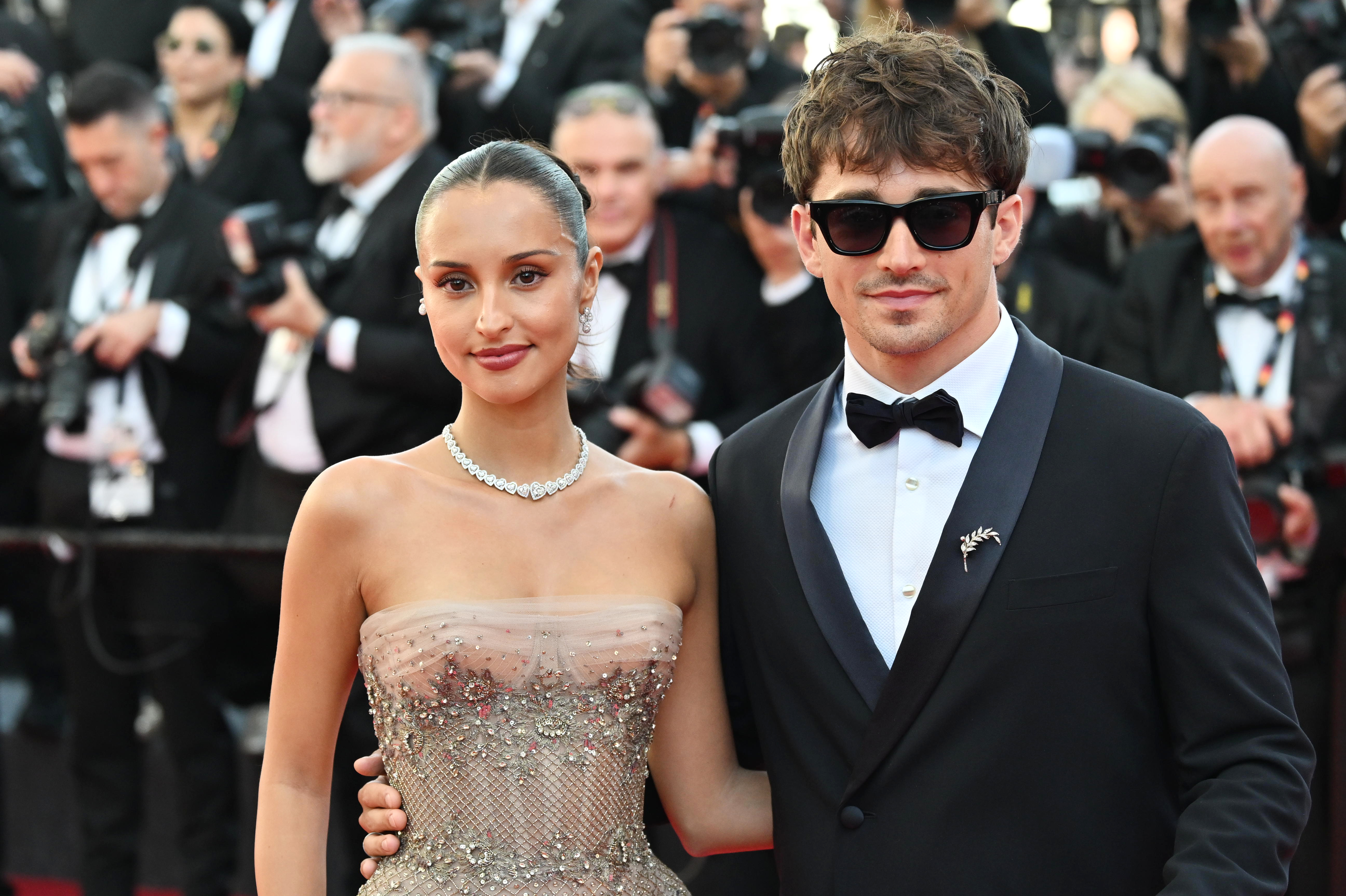 Charles and Alexandra Leclerc pose together at the 2026 Cannes Film Festival in red carpet looks
