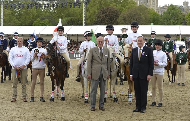 Members of Team England, winners of The DAKS Pony Club Games, being presented with the Prince Phillip Cup by HRH Prince Phillip at the Royal Windsor Horse Show in the private grounds of Windsor Castle in Windsor in Berkshire in the UK between 10th-14th May 2017