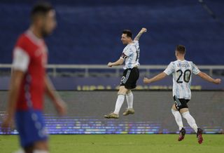 Lionel Messi celebrates scoring against Chile