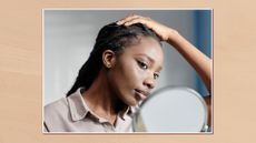 Image of a woman looking into a round mirror, in a white frame set against a warm beige watercolour-style background