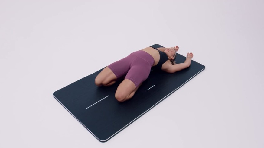 Saddle pose woman leaning back with arms overhead