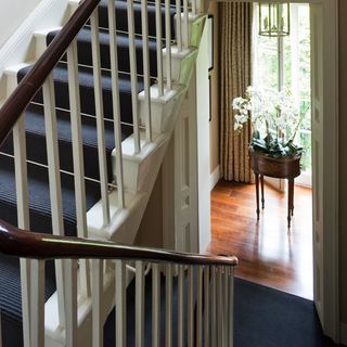 classic staircase with dark wooden banister