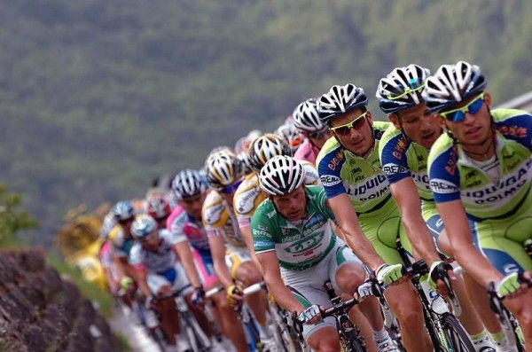 Danilo Di Luca is tucked in behind the trio of Liquigas riders on the climb to Alpe di Siusi.