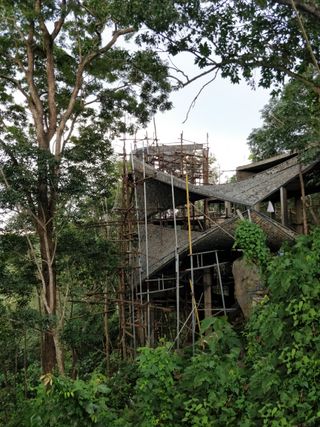 House under construction in the greenery