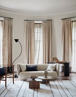 Neutral living room with beige sofa and beige curtains