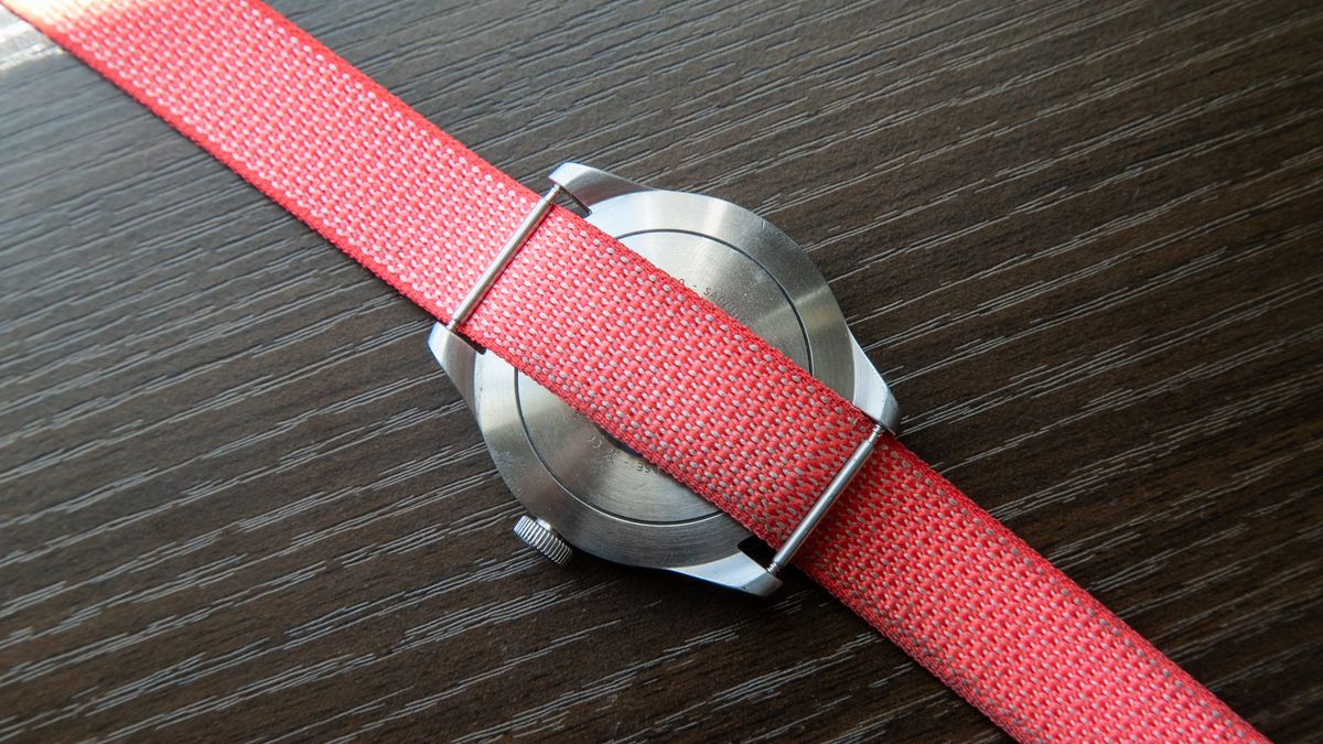 Google Fitbit Air band with an analogue watch