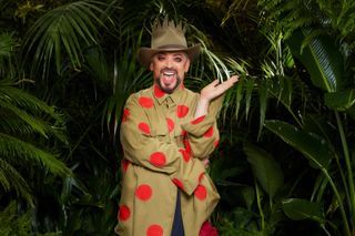 Boy George posing for a photo in his I'm A Celeb outfit
