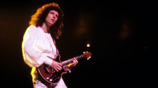 Photo of Brian MAY and QUEEN, Brian May performing on stage