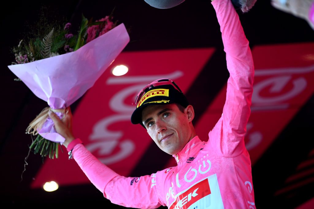 NAPOLI ITALY MAY 14 Juan Pedro Lpez of Spain and Team Trek Segafredo celebrates winning the pink leader jersey on the podium ceremony after the 105th Giro dItalia 2022 Stage 8 a 153km stage from Napoli to Napoli Giro WorldTour on May 14 2022 in Napoli Italy Photo by Tim de WaeleGetty Images