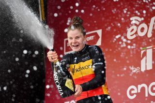 SIENA ITALY MARCH 05 Lotte Kopecky of Belgium and Team SD Worx celebrates winning the race on the podium ceremony after the Eroica 8th Strade Bianche 2022 Womens Elite a 136km one day race from Siena to Siena Piazza del Campo 321m StradeBianche on March 05 2022 in Siena Italy Photo by Luc ClaessenGetty Images