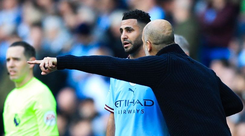 Pep Guardiola gives Riyad Mahrez instructions in Manchester City&#039;s Premier League game against Leicester in April 2023.