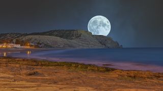 November 2022 full moon; Full moon over the coast of Praia da Luz in the Algarve