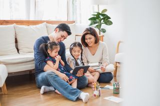 Family of four using computer