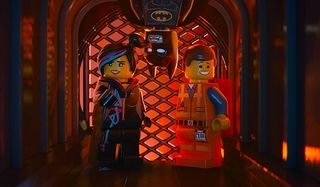 The Lego Movie Wyldstyle and Emmet with Batman dropping in between them