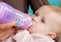 Bottle-feeding a baby - bottle-fed, bottle-feed, bottle, baby, drink, drinking, milk, features news, Marie Claire