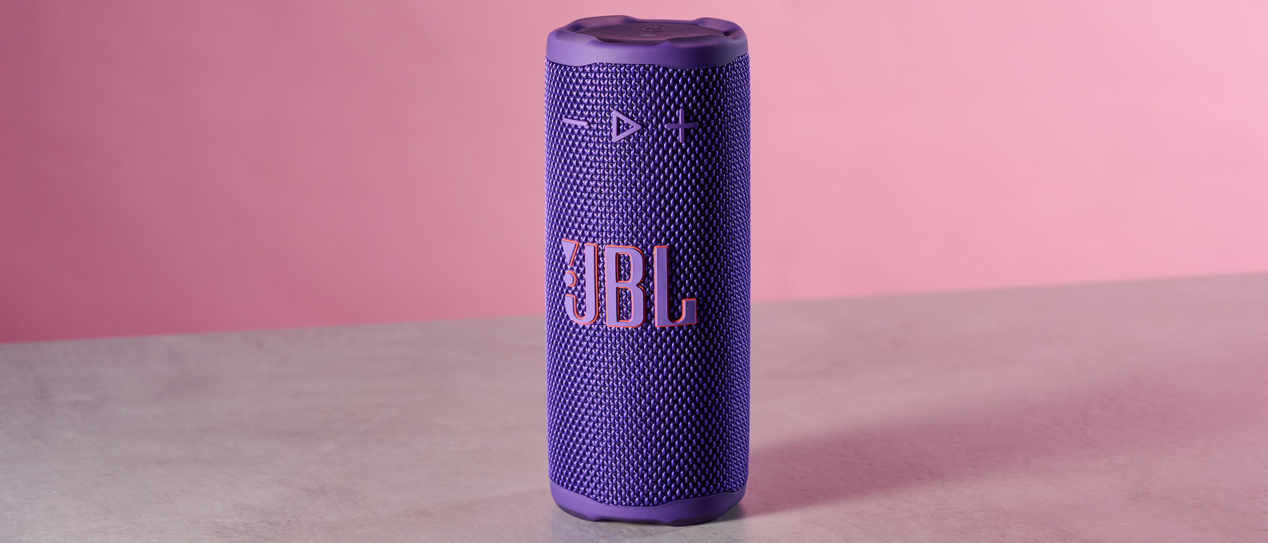 JBL Grip against pink background