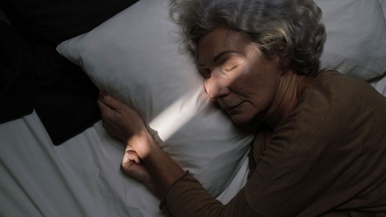 An elderly woman sleeping
