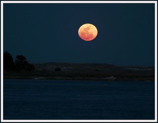 Photographer John Bellm snapped this view of the full moon rising north of Carolina Beach, NC on the Intracoastal Waterway on March 19, 2011 during a supermoon event - while th emoon was at perigee, its closest to Earth in more than 18 years.