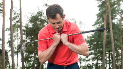 PGA pro Dan Grive demonstrating how to set up for a flop shot
