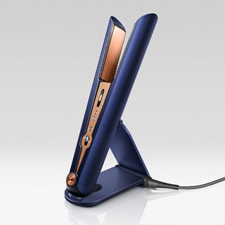dyson corrale black friday hacks - copper and blue straighteners in a stand