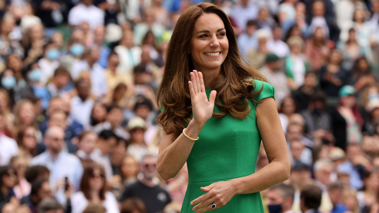 HRH Catherine, The Duchess of Cambridge waves to the crowd after the Ladies&#039; Singles Final match between Ashleigh Barty of Australia and Karolina Pliskova of The Czech Republic on Day Twelve of The Championships - Wimbledon 2021 at All England Lawn Tennis and Croquet Club on July 10, 2021 in London, England.