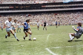 Diego Maradona scores his second goal for Argentina against England at the 1986 World Cup.