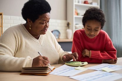 Financial education: mother teaching child about money