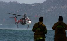 Helicopter scoops water from Lake Tahoe