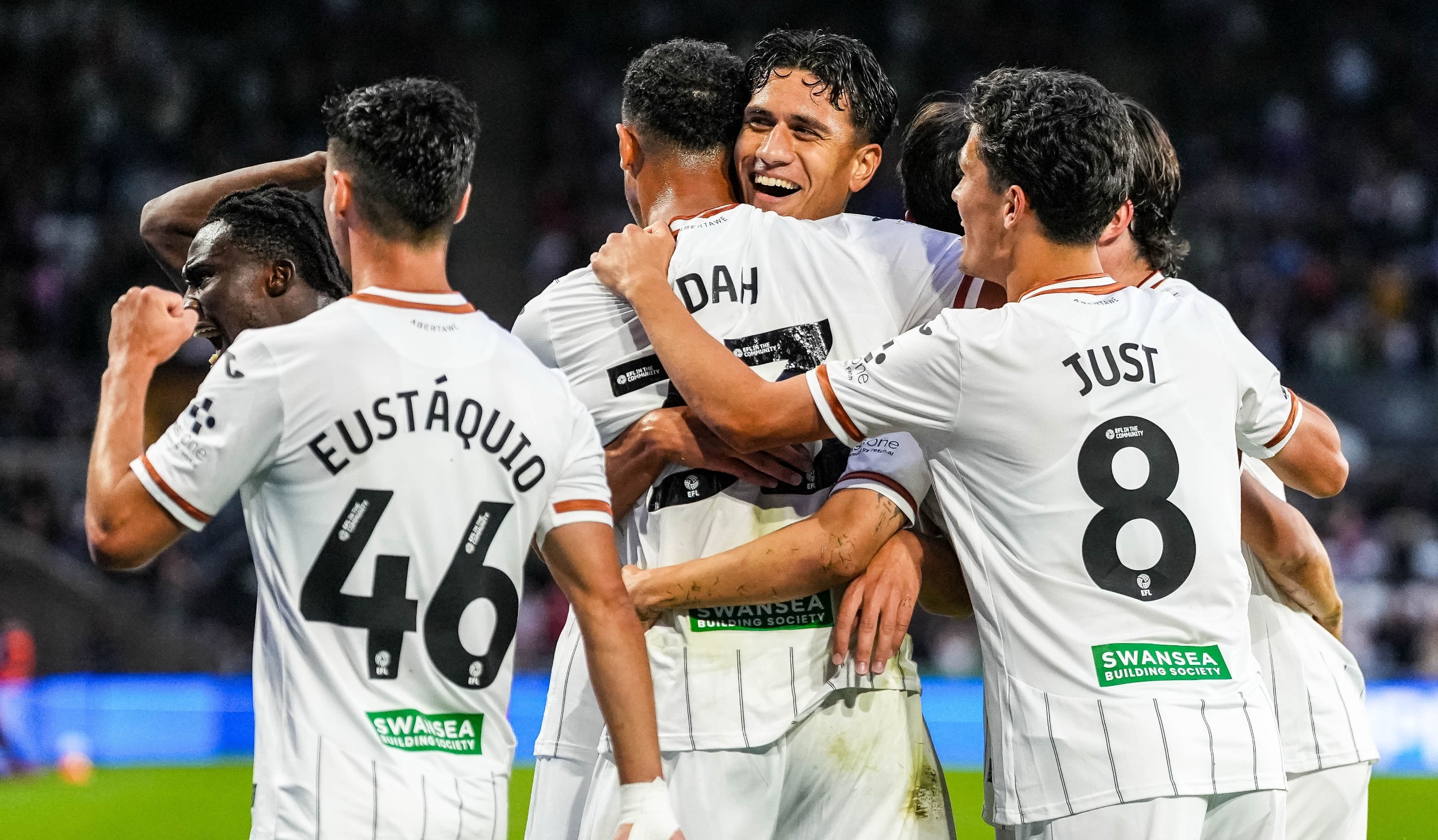 Eom Ji-Sung of Swansea City celebrates scoring his team's first goal with his teammates in the Championship game against Watford at Swansea.com Stadium in Swansea, United Kingdom, on September 1, 2026