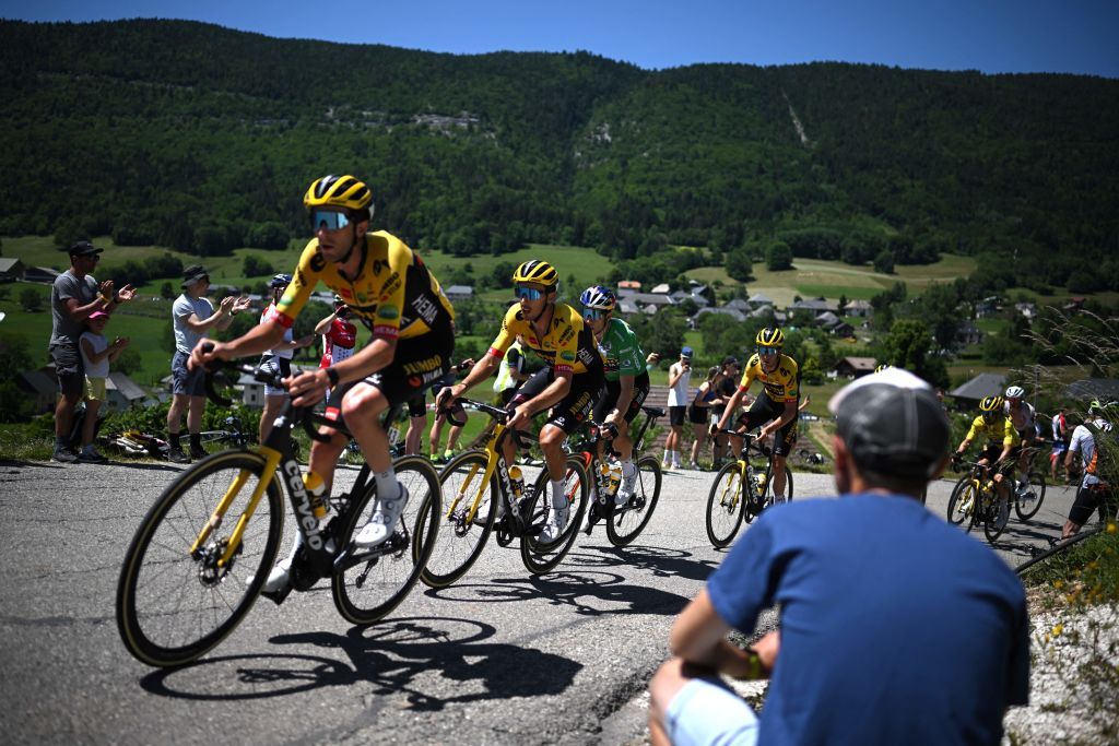 JumboVisma teams Belgian rider Wout Van Aert CGREEN rides with teammates in the peleton during the eighth stage of the 74th edition of the Criterium du Dauphine cycling race 1375 km between SaintAlbanLeysse and Plateau de Solaison on June 12 2022 Photo by Marco BERTORELLO AFP Photo by MARCO BERTORELLOAFP via Getty Images