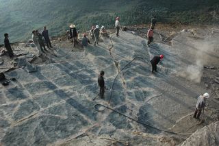 Here, students and farmers help excavate the track marks made by nothosaurs 245 million years ago.