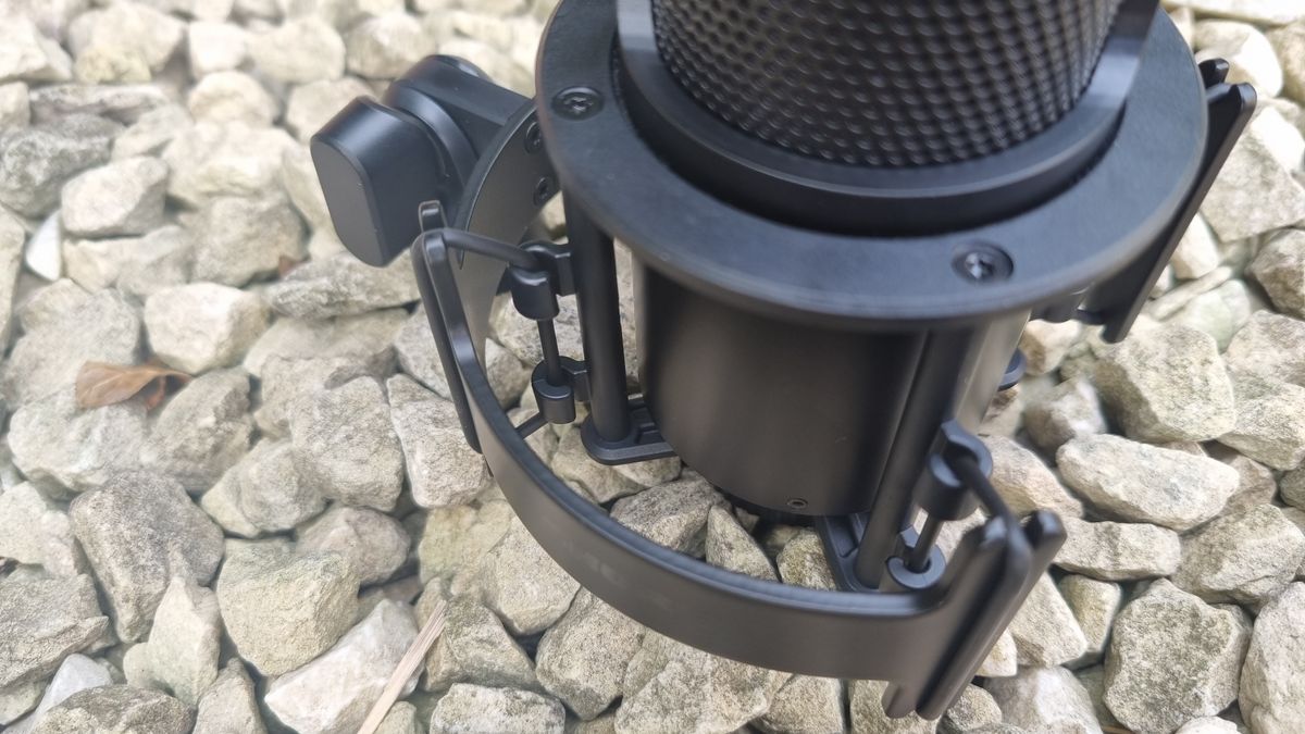 The Shure SM4 Studio Kit, shown on a white gravel background