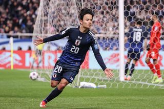 SAITAMA, JAPAN - MARCH 20: Japanese players pose for photographers as they qualified for the World Cup 2026 during the FIFA World Cup Asian qualifier Group C match between Japan and Bahrain at Saitama Stadium on March 20, 2025 in Saitama, Japan. (Photo by Kaz Photography/Getty Images)