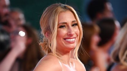 Stacey Solomon smiling wearing pink dress