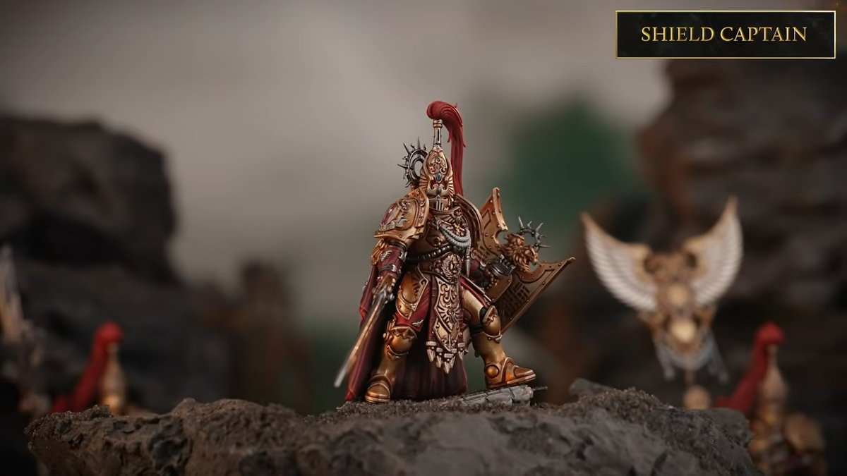 Warhammer Custodes miniatures on a blasted battleground