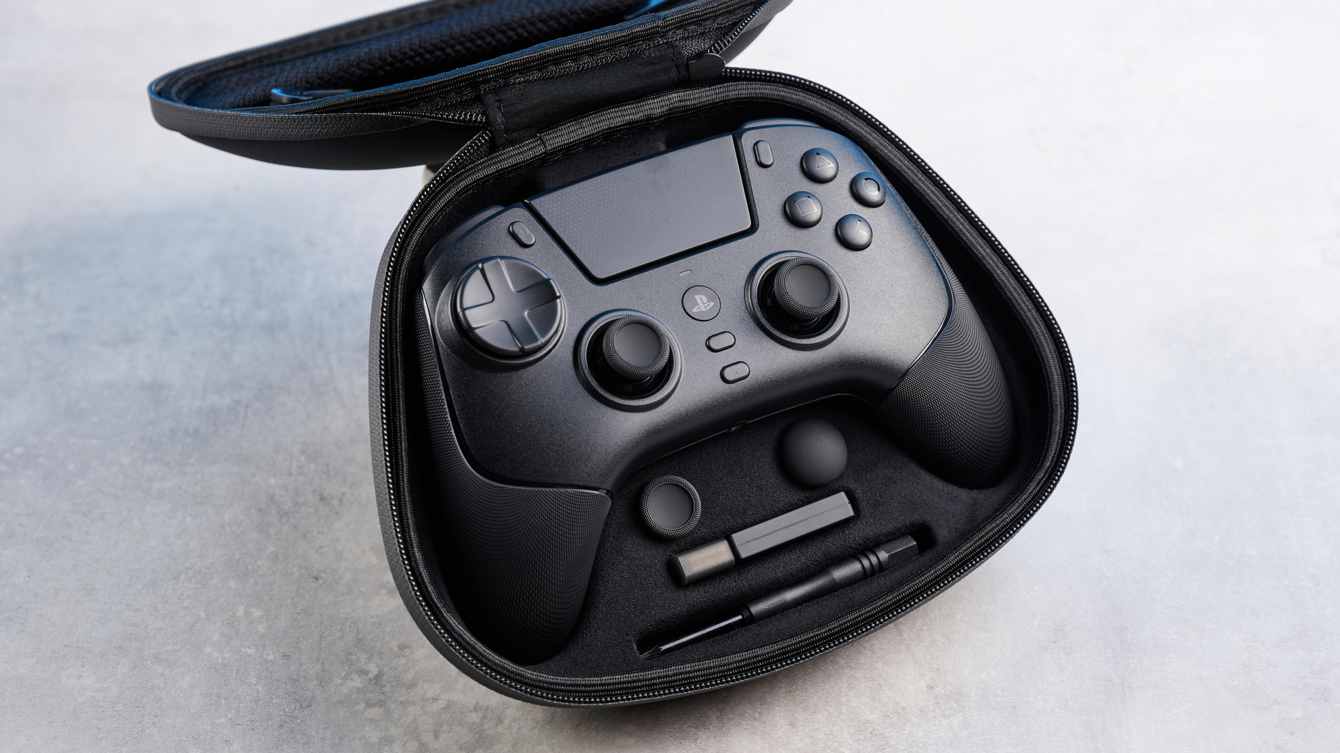 A black Razer Raiju V3 Pro controller for the PS5