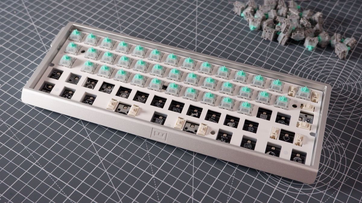 The Wooting 60HE v2 at various stages of being built.