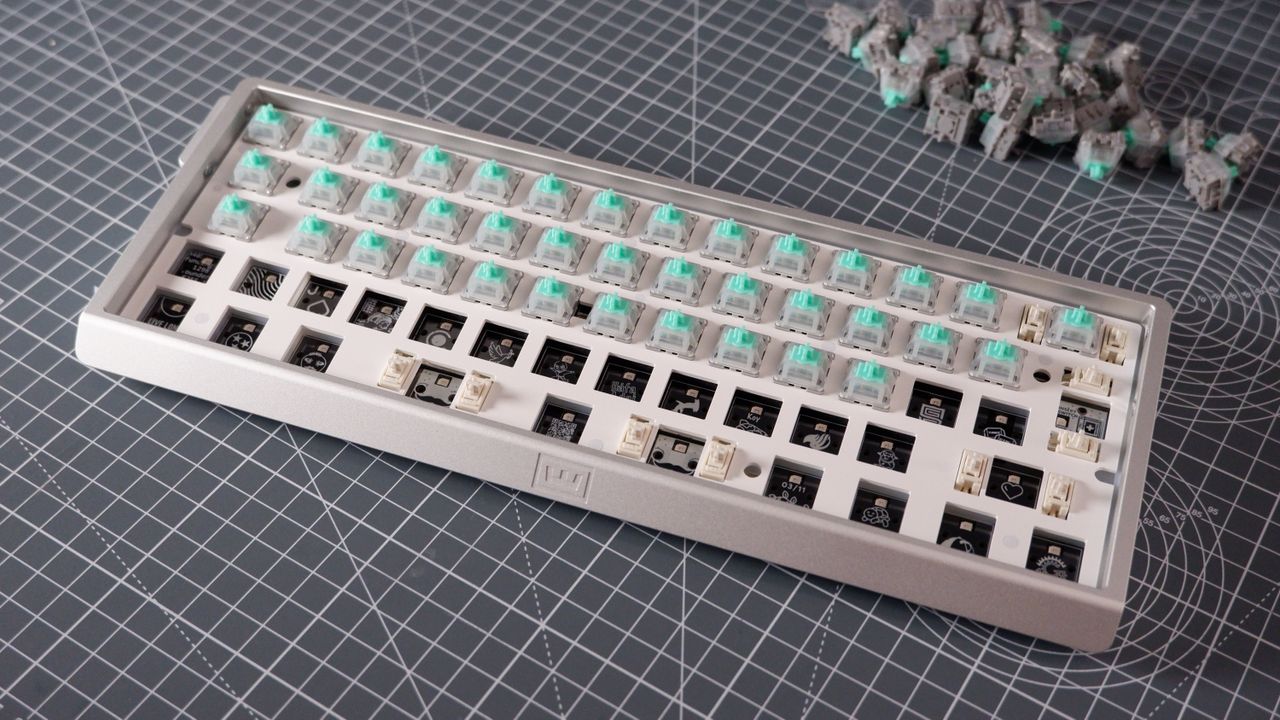 The Wooting 60HE v2 at various stages of being built.