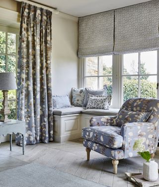 country living room with blue and white flower fabric curtains